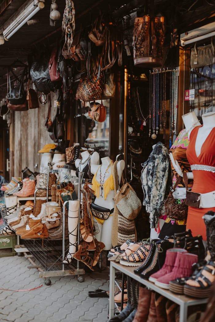 gallery-4 Vibrant street market stall showcasing diverse apparel and accessories, ideal for urban shopping scenes.